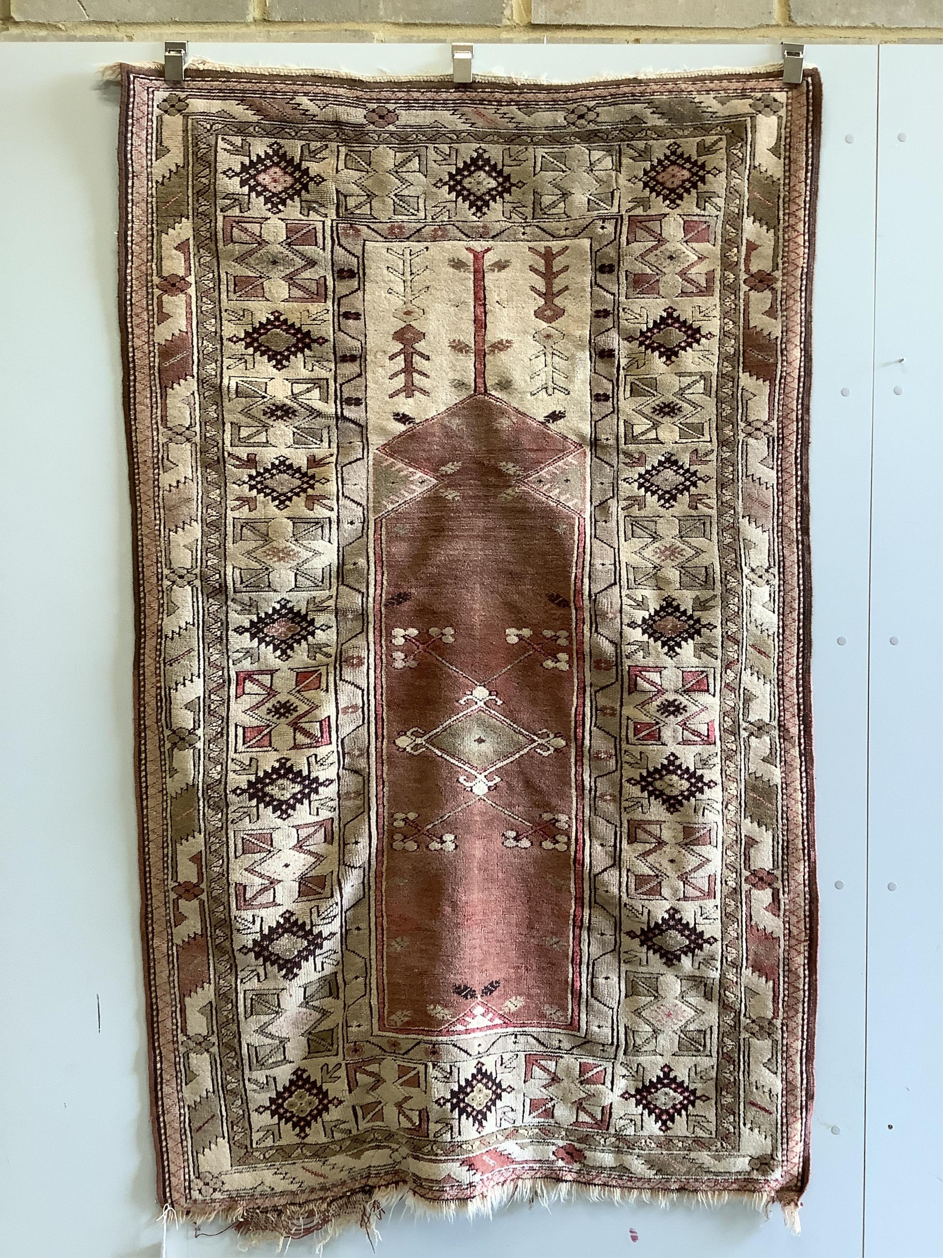 A Caucasian design red ground prayer rug, 193 x 124cm